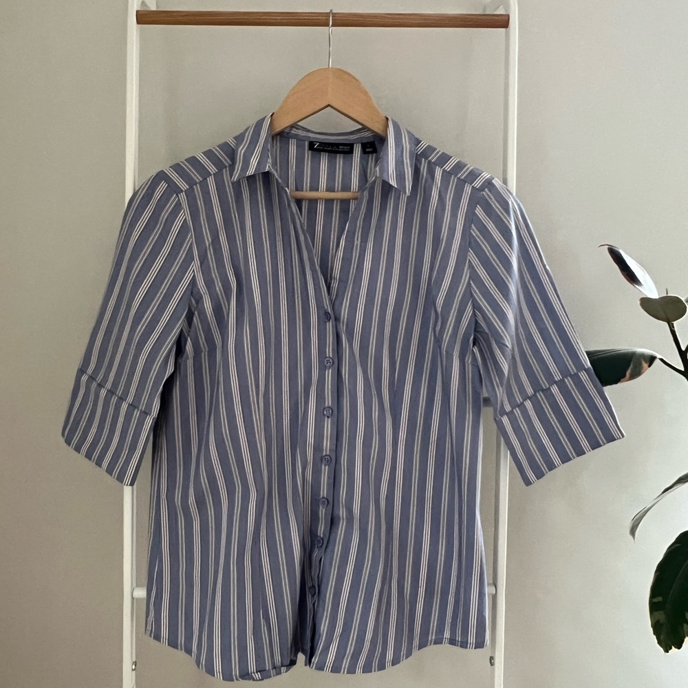 Button up shirt has all buttons no stain. In good condition